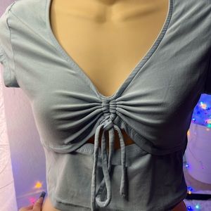 blue crop top with tie in the middle , bought at burlington